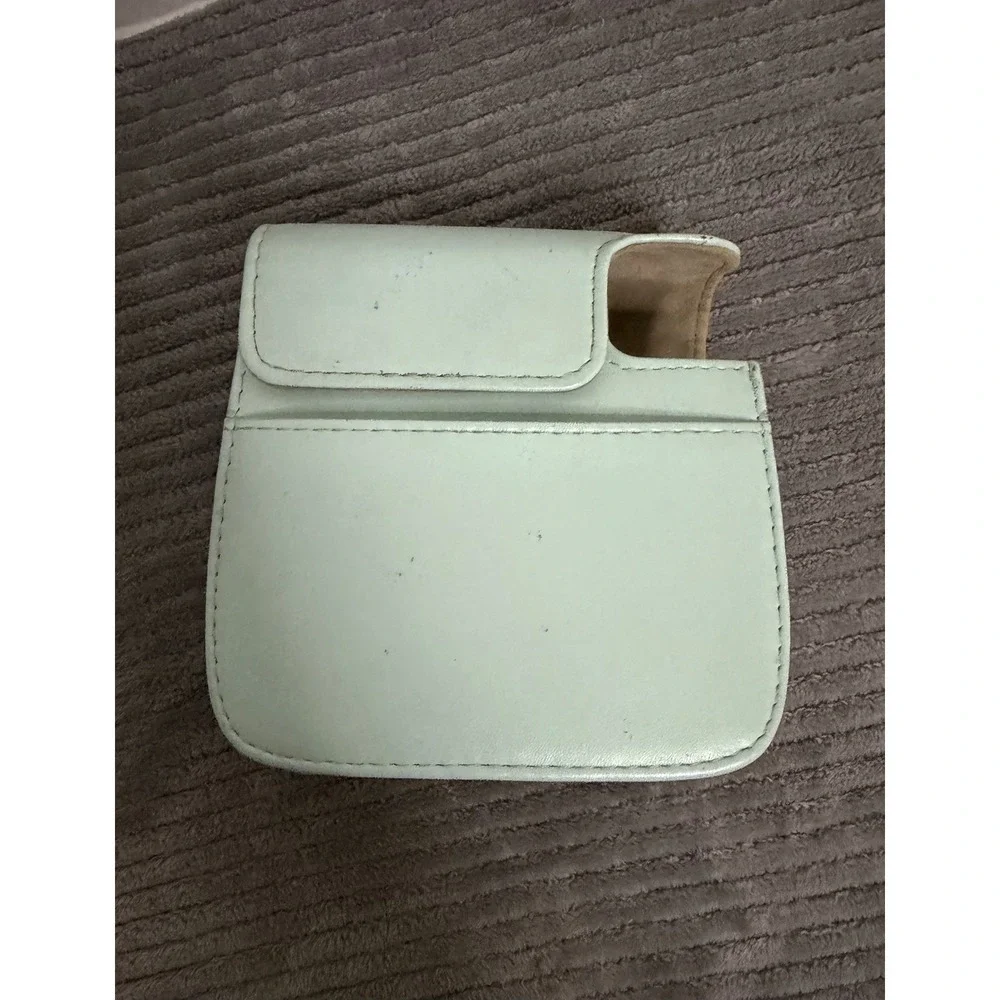 green camera case is designed for Fujifilm Instax Mini cameras